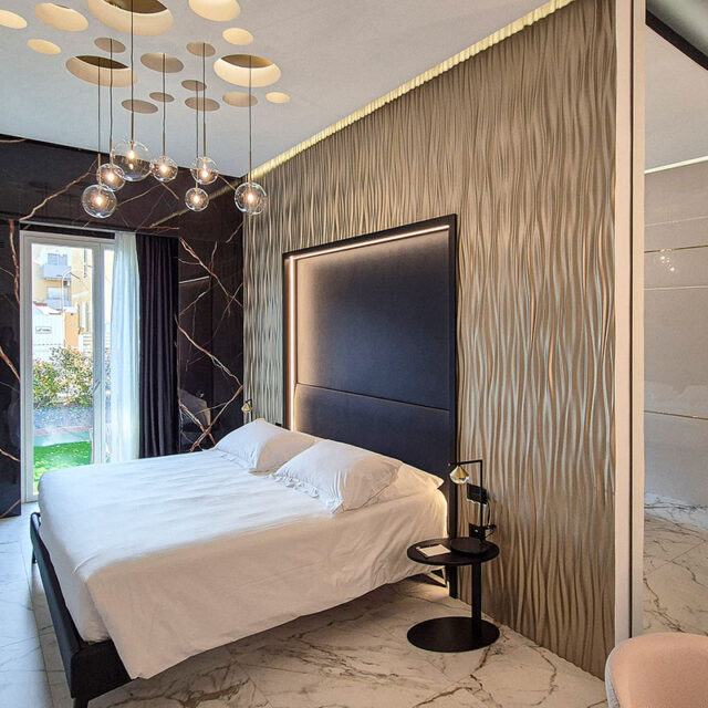 https://www.gruppo5.it/wp-content/uploads/2025/07/design-camere-hotel-lusso-marmo-oro-13-640x640.jpg